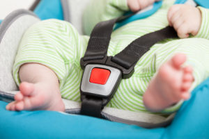 Little baby child in safety car seat